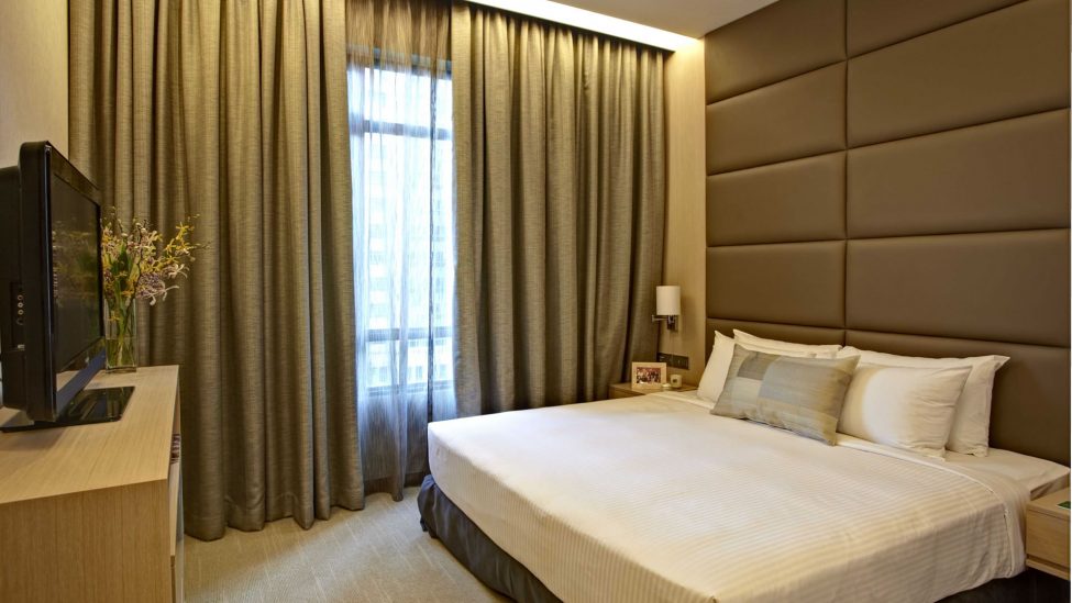 bedroom of one bedroom premier service apartments in singapore for a week lease