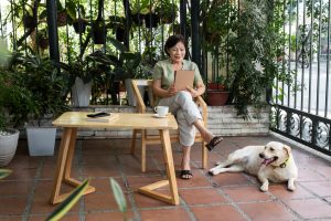 woman sitting with pet dog
