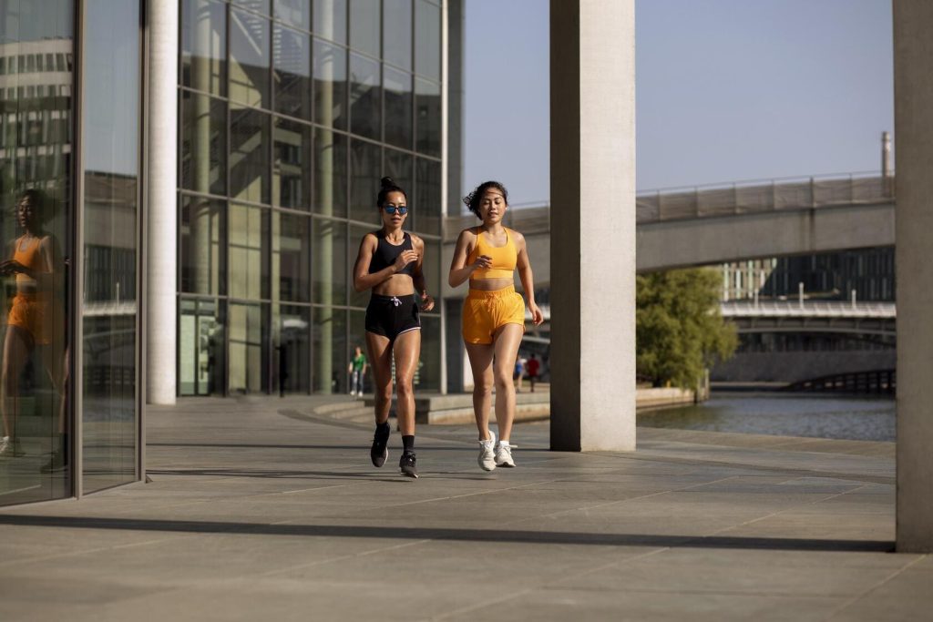 full-shot-women-running-outside