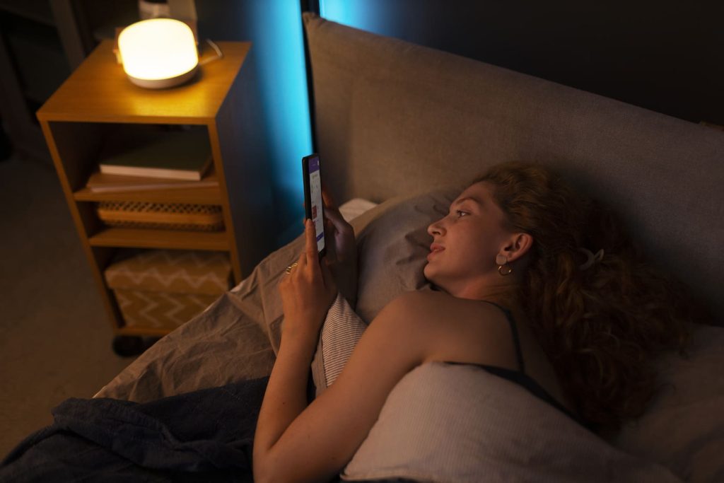 high-angle-woman-laying-bed